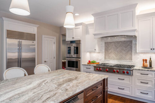 This is a picture that includes the refrigerator, stove top, microwave, and double-oven from a kitchen in Henderson Nevada. 