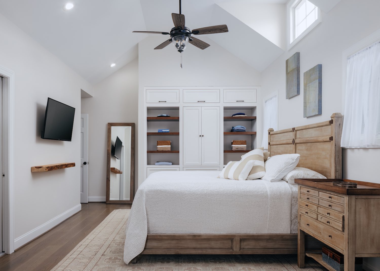 a picture of a bedroom with custom closet and shelving by Kountry Kraft Custom Cabinetry