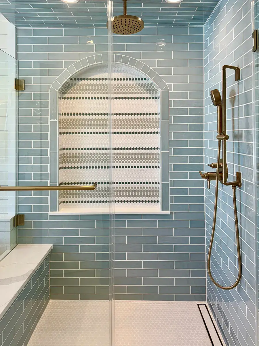 Blue Tiles and Gold Accents in the Shower