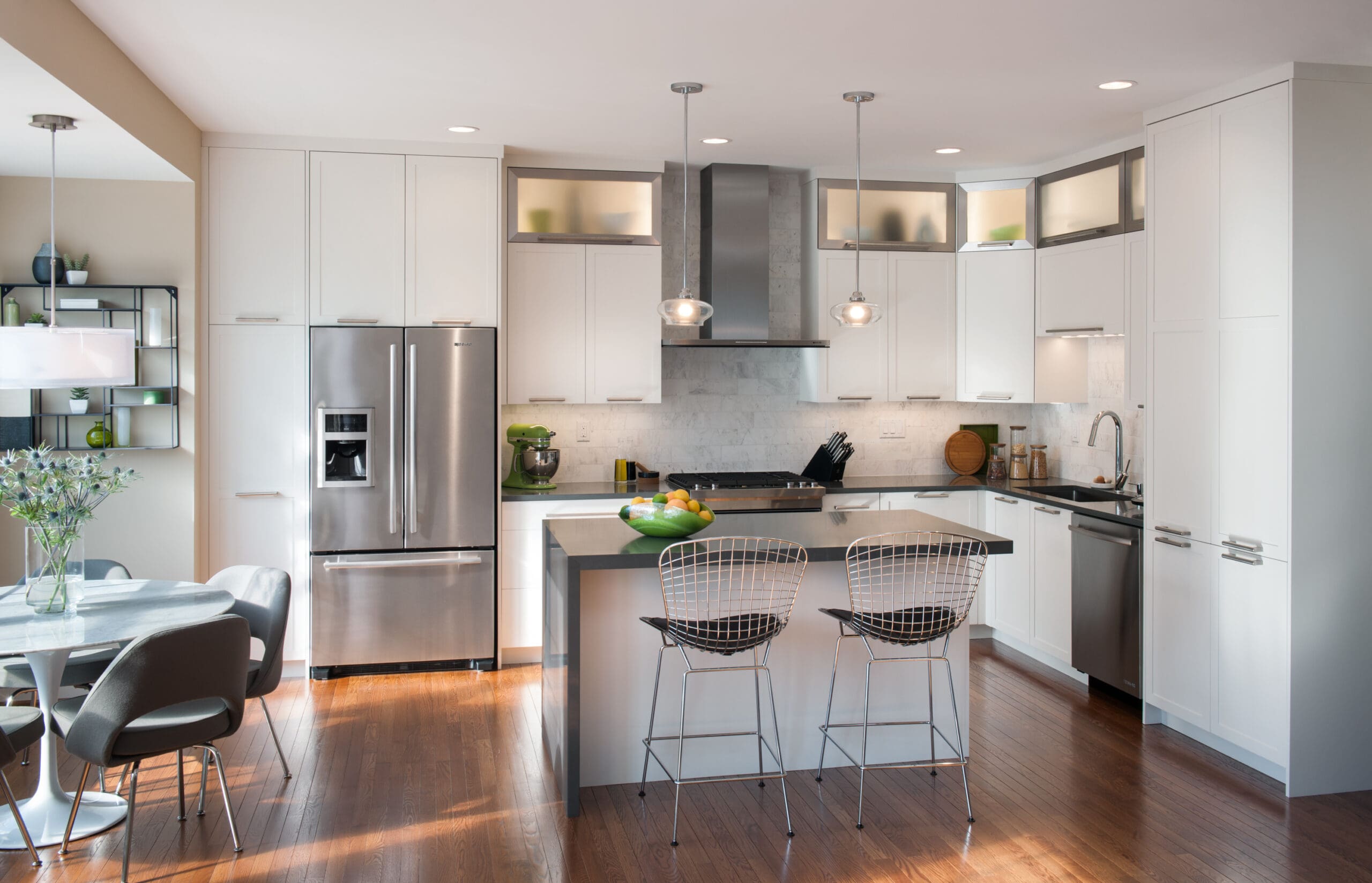 This kitchen features an L Shaped Kitchen Layout that Provides Extra Seating and Storage 