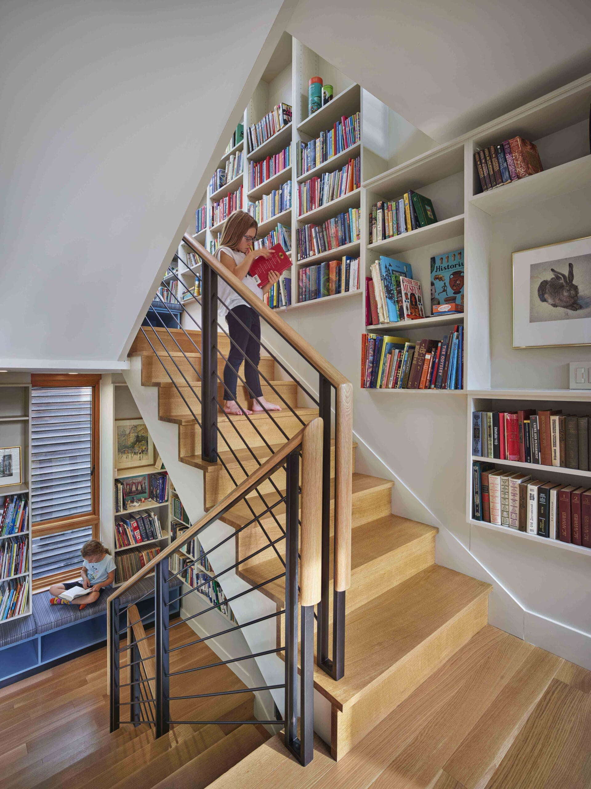 Vertical Library featuring Bookcase Bench Cabinets Acting as Office Cabinets to keep Books and Toys Organized