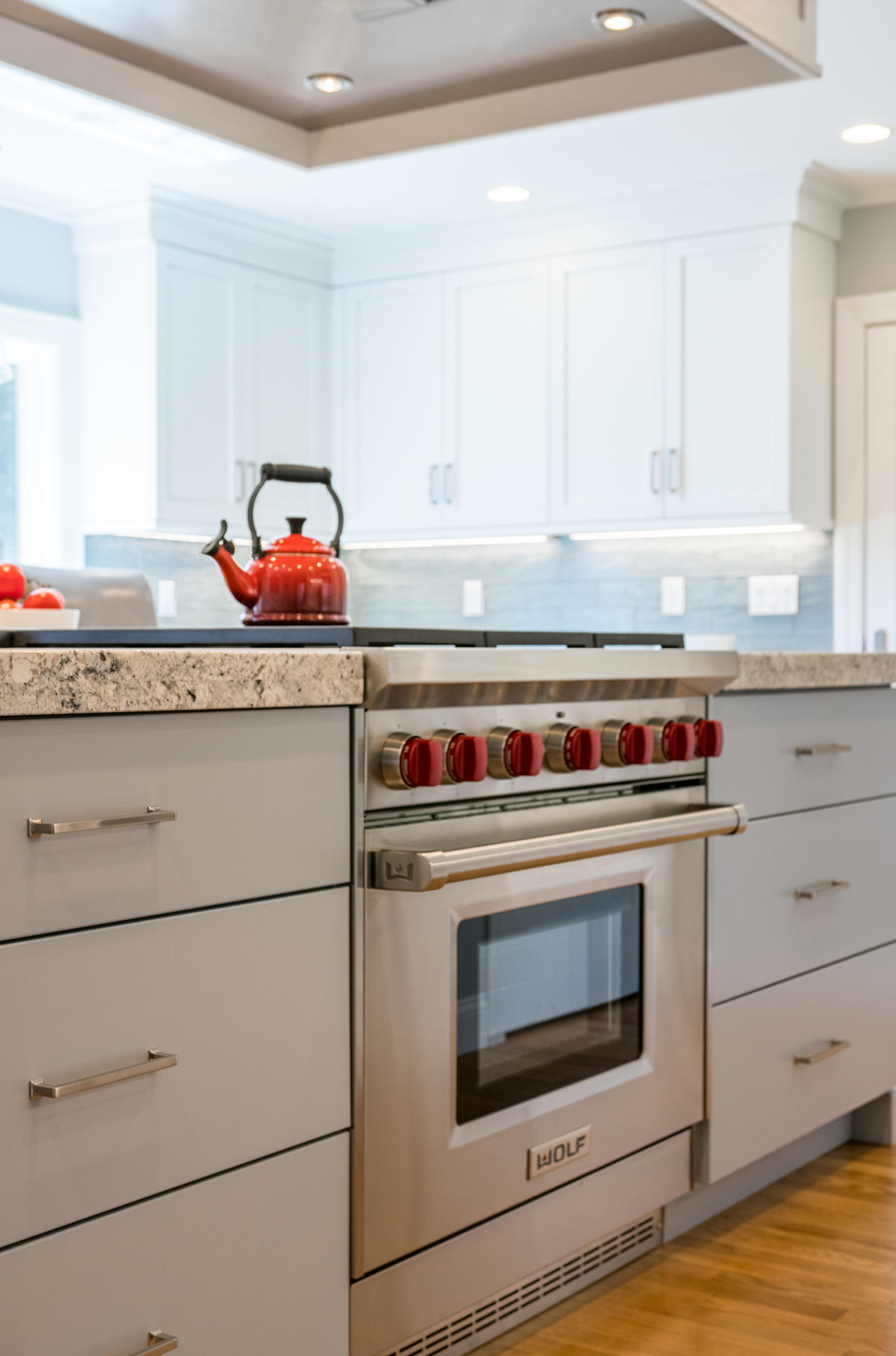 Kitchen Island Finished in Benjamin Moore Shadow Gray Featuring Silver Pulls as Hardware 