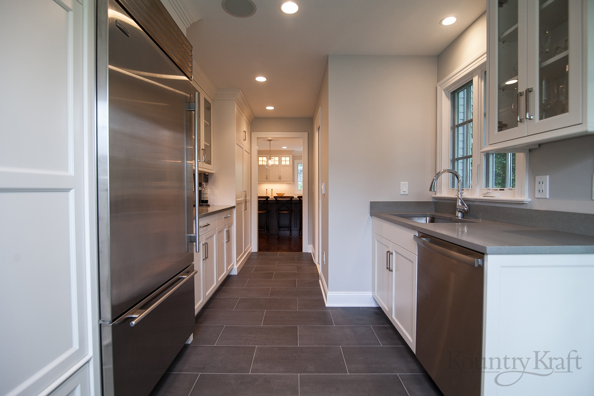 Galley Kitchen Layout with White Cabinets