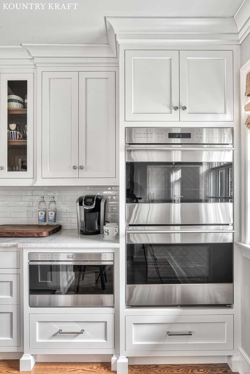 Stainless Steel Appliances integrated into Alpine White Cabinetry in a Kitchen in Summit, New Jersey